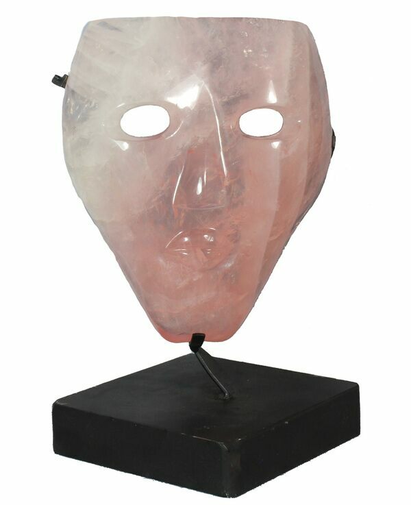 A decorative mask carved from Brazilian rose quartz
